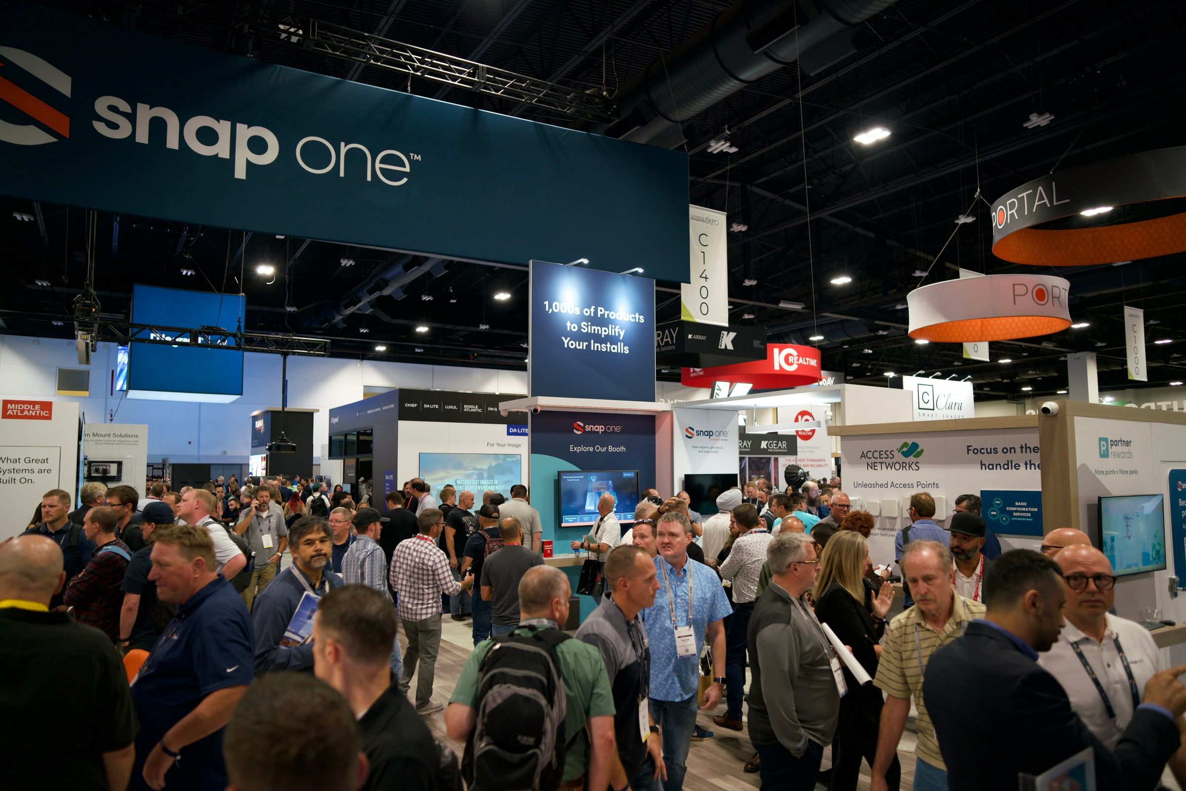 Wide view across the full booth during show hours